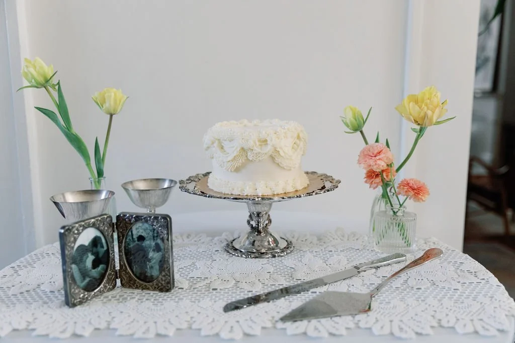 Wedding cake surrounded by delicate floral details.