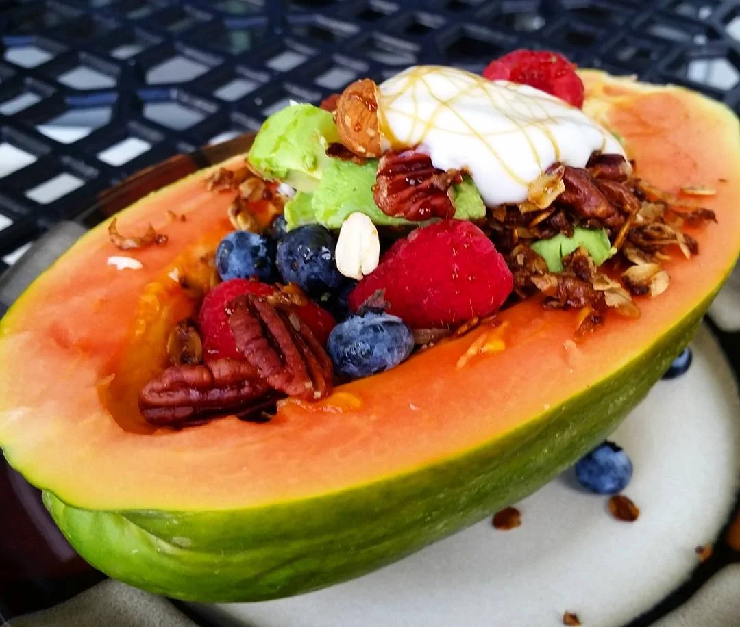 Papaya filled with Coconut Granola, Fresh Fruit, and Yogurt
