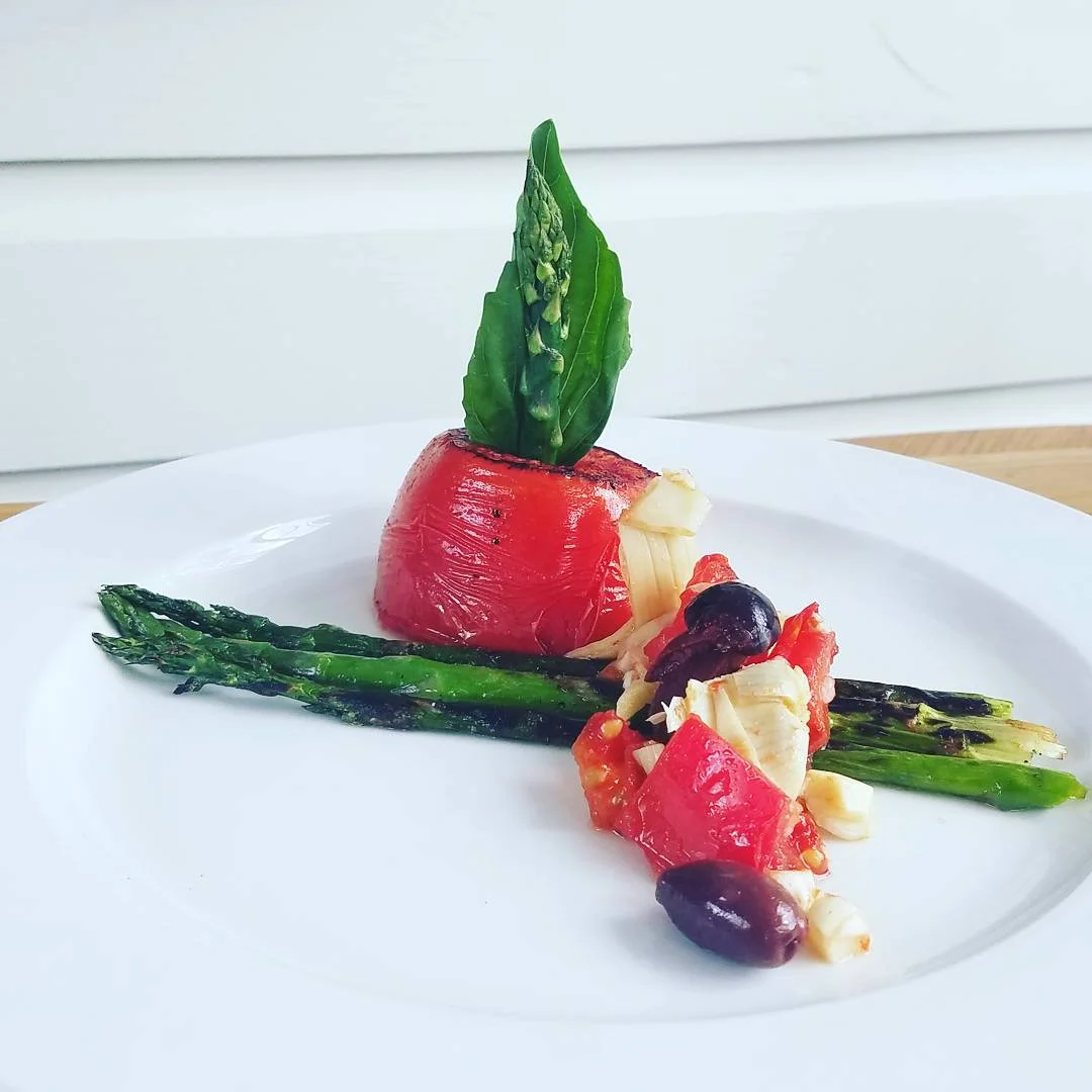 Grilled Asparagus with Charred Tomato, Olive, and Artichoke Bruschetta