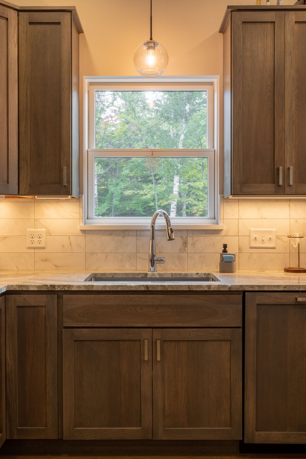 Cabinets, Counters, Floors and Tile designed and installed by Birchwood Interiors