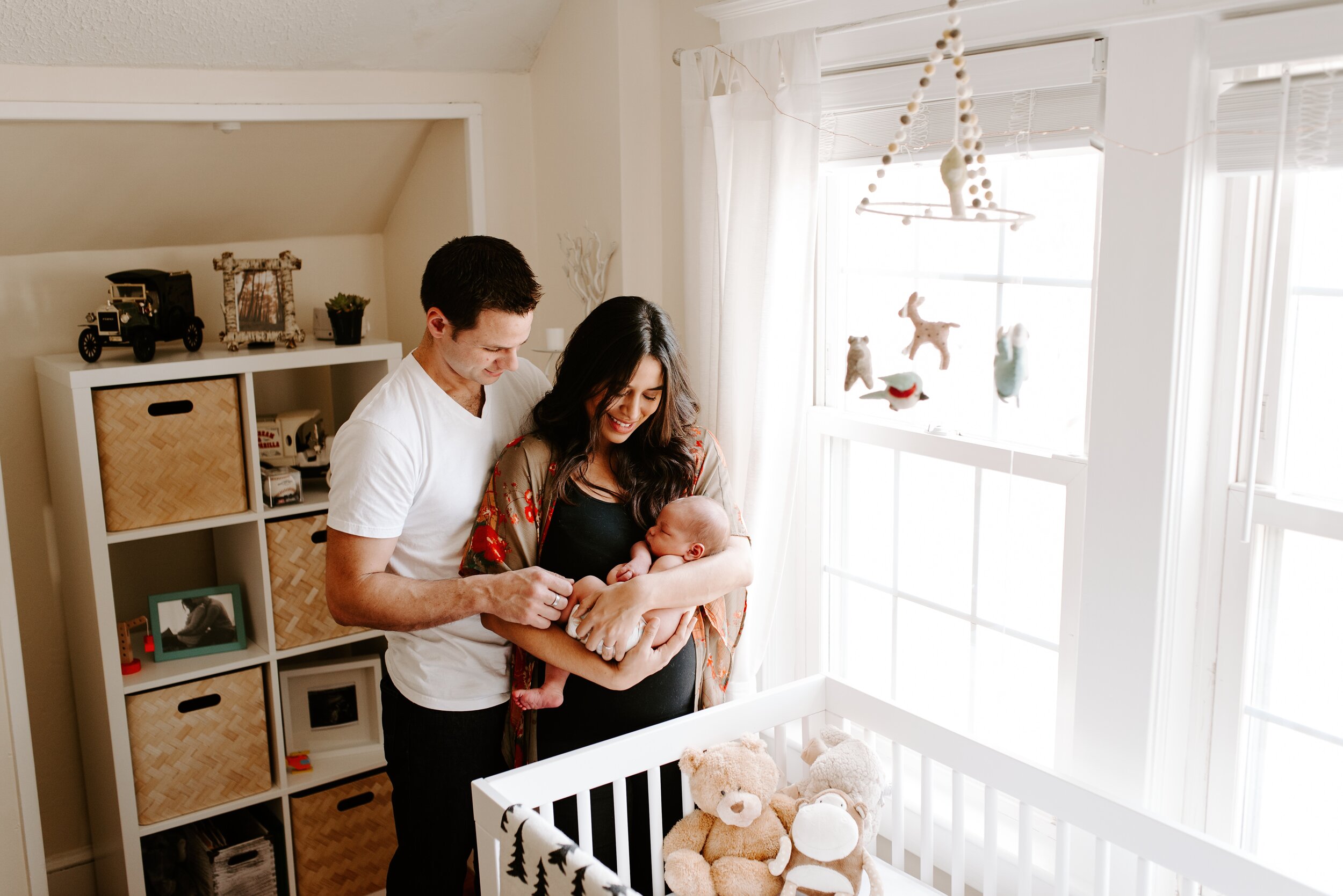 Connecticut New England At Home in Nursery Newborn Baby Held by Mom and Dad Lifestyle Portrait.jpg
