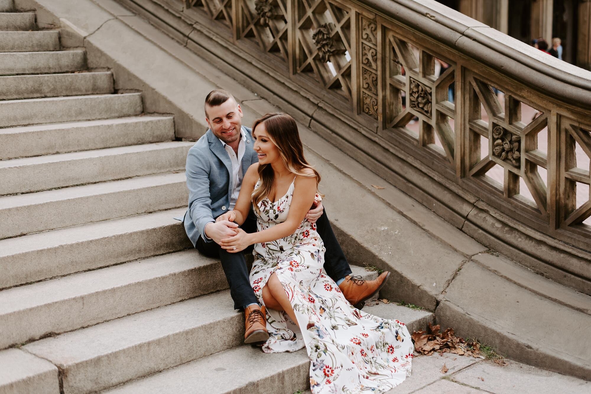 New York City Engagement Session Couples Photos Central Park Bethesda Terrace & Fountain Couple Sitting in Stairs.jpg
