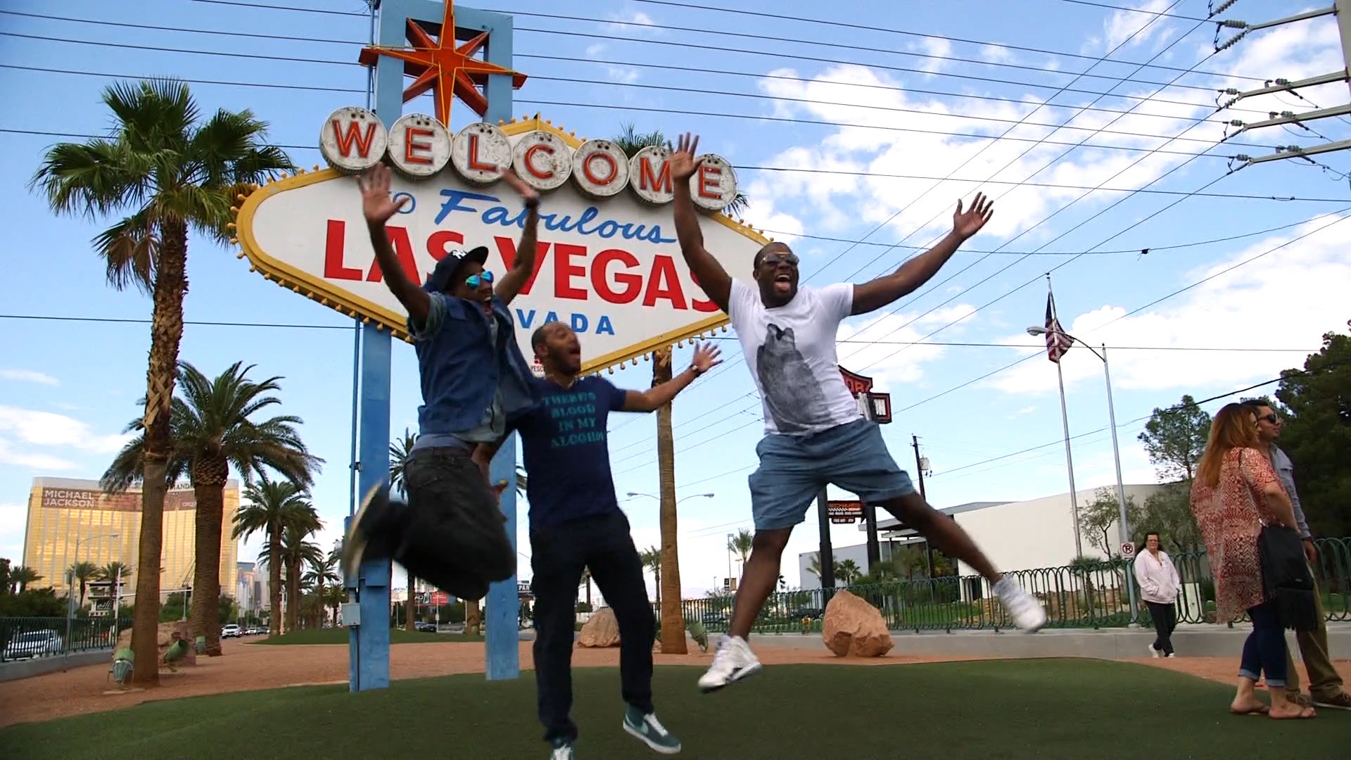 Anthony and friends jumping in front of Las Vegas sign (1).jpg