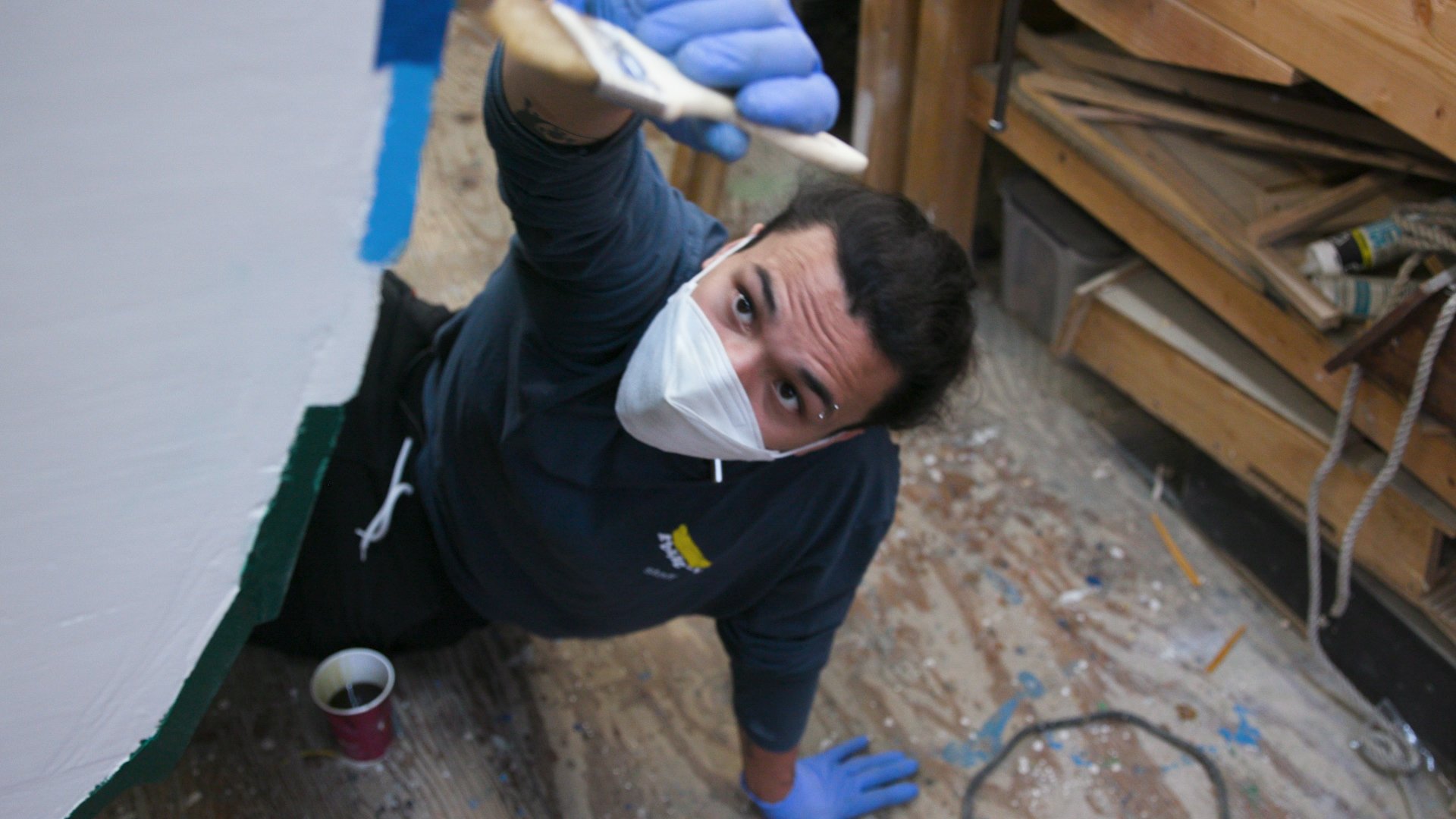 Frankie Cabrera Varnishing Boat.jpg