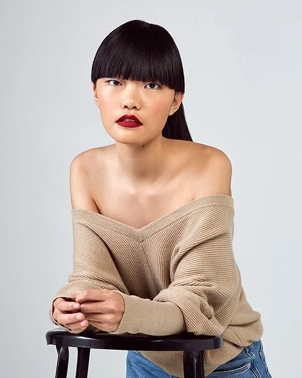 Full straight across bangs.webp