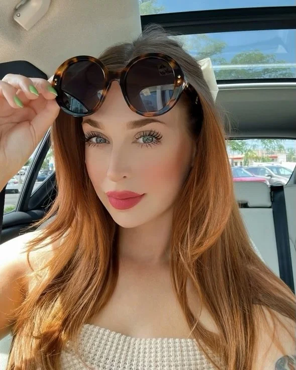 Copper hair blue eyes sunglasses.jpg