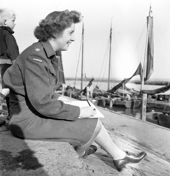 Molly Lamb Bobak sketching boats in Volendam, the Netherlands Photo from the Library and Archives of Canada