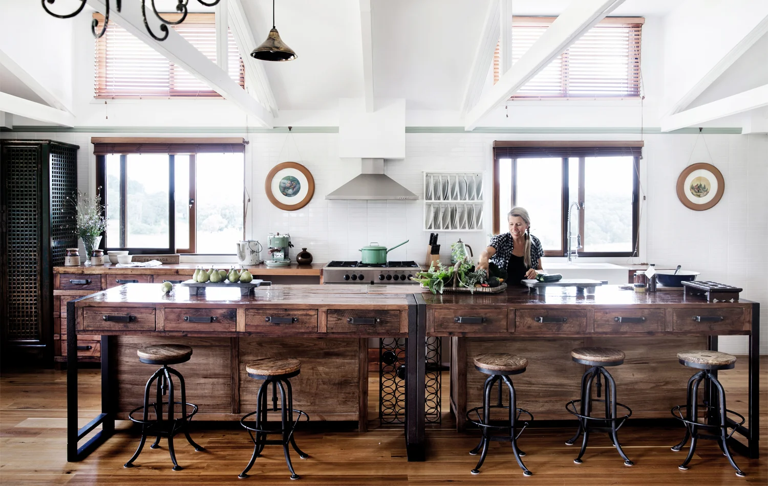 Homeowner and chef Brigid Kennedy prepares one of her sublime preserves in the custom-designed kitchen. Photography by Chris Warnes.
