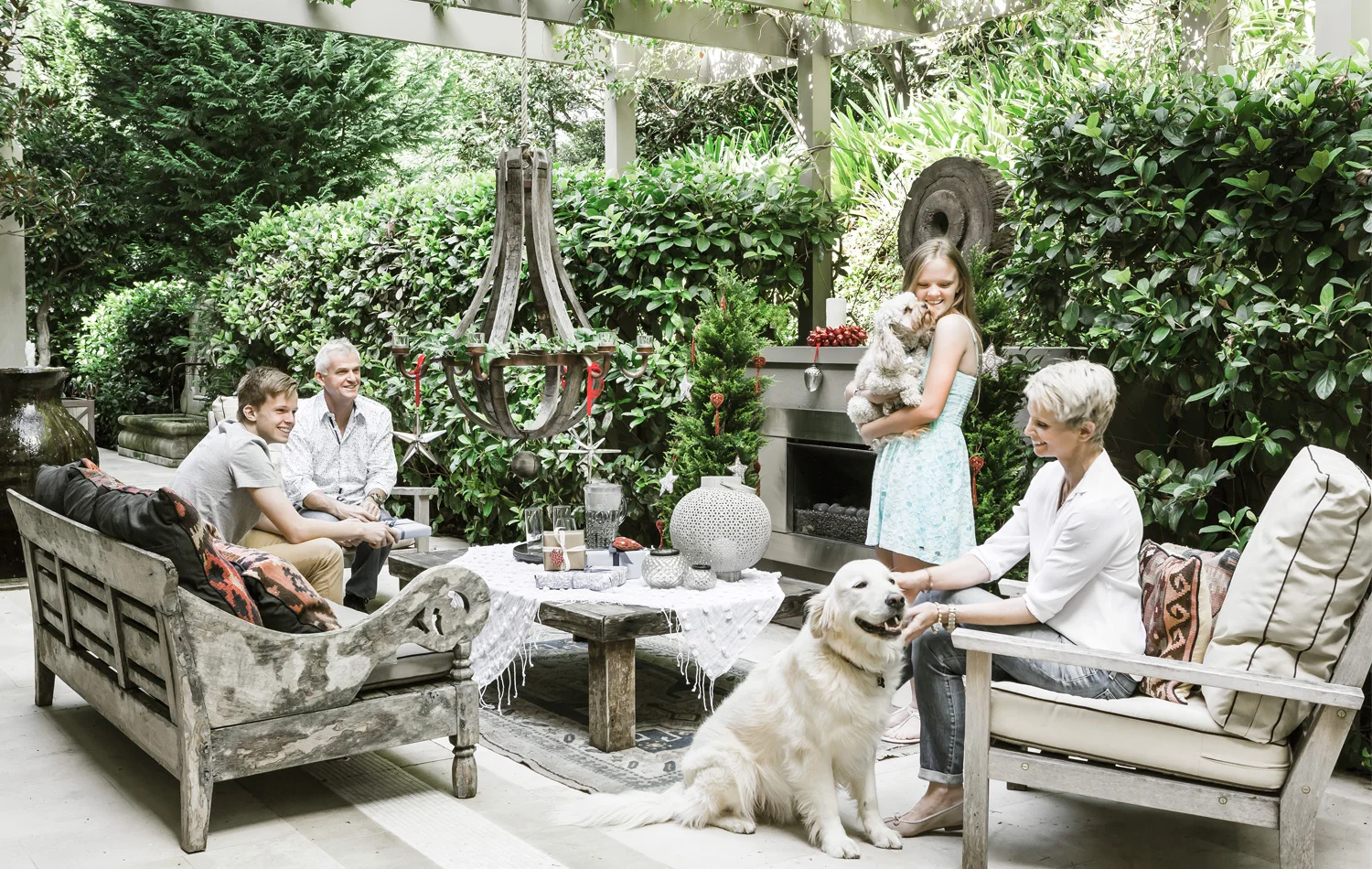 This is a much-used outdoor space for Phil and Ann-Maree Kerry, pictured with children Jack and Isabelle, cavoodle Oscar, and Toby, aloveable goldenretriever with a keen interest in shiny baubles. Photography by maree homer.