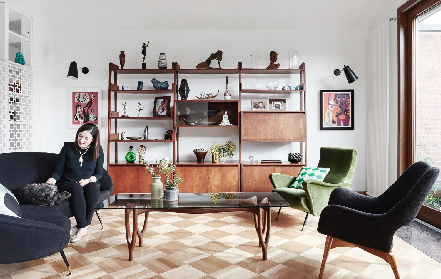 Meagan gives Harry the spoodle a tickle in the light-flooded living room. Photography by Eve Wilson.