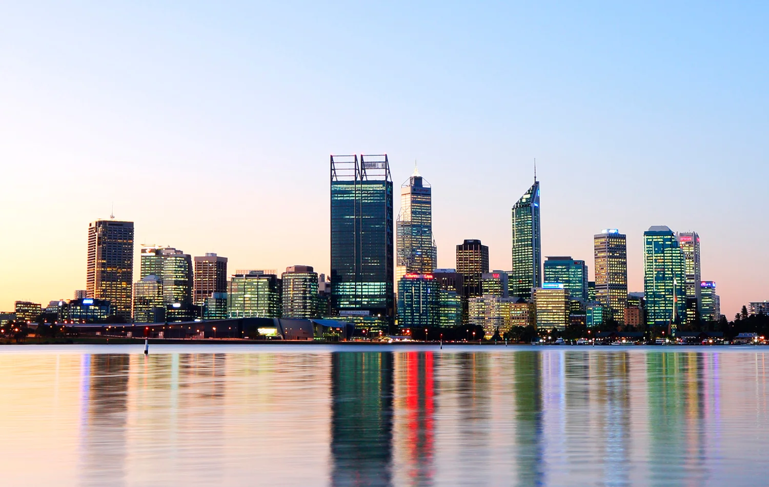 The Perth skyline at twilight, with the 46-storey City Square skyscraper that houses BHP Billiton (middle). &nbsp;Photography by Louis Liu.