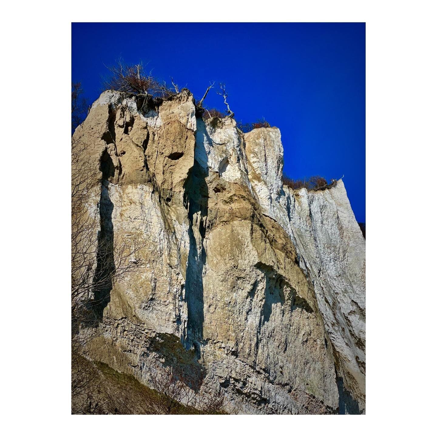 a face in the cliffs gazing towards out to sea.