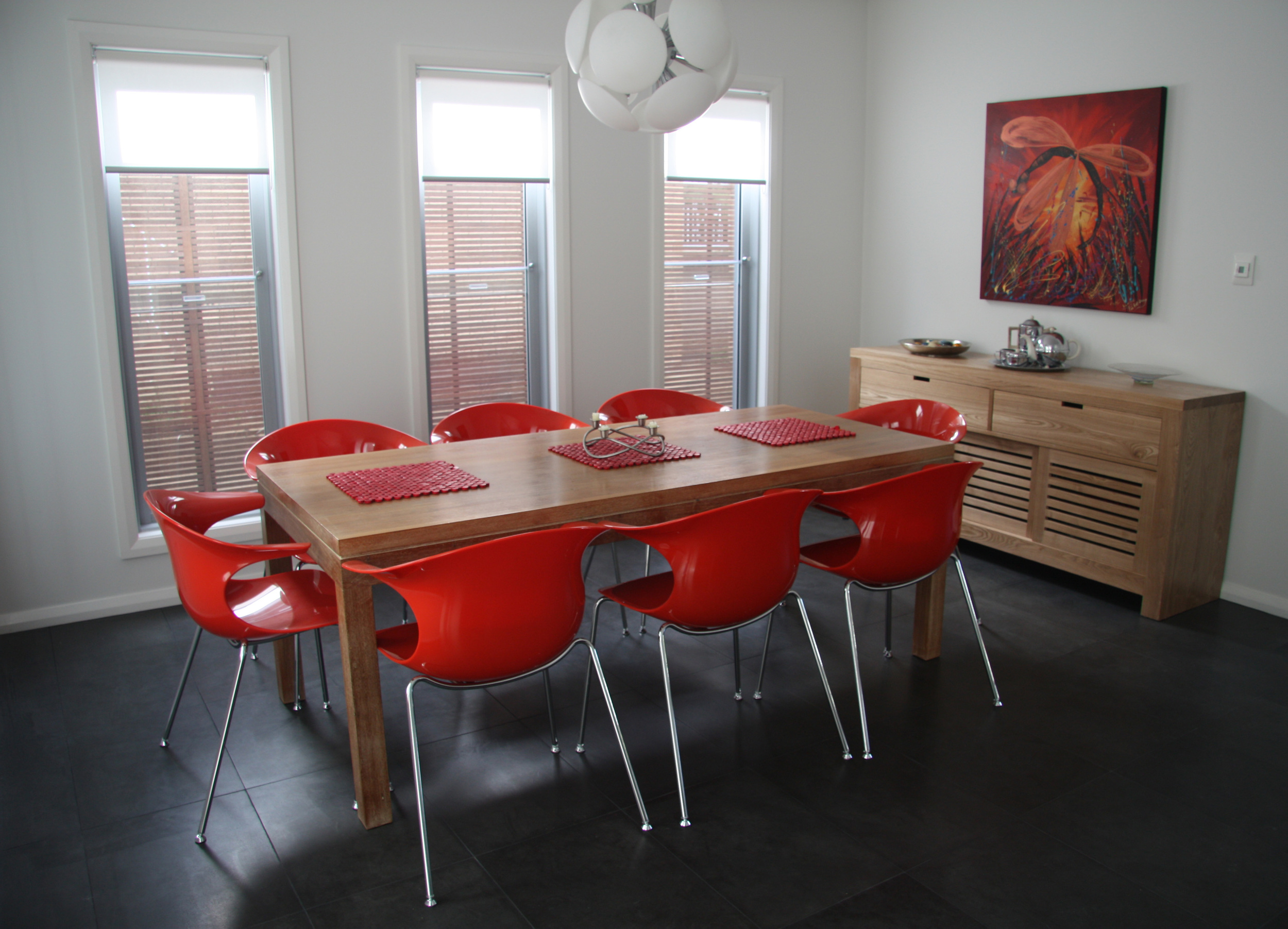  This image is one taken from a beautifully designed home with bluestone throughout - dining room, kitchen, living room and hallway.&nbsp;The result is stunning bright colours e.g. red being used to contrast the formality of the dark grey bluestone. 