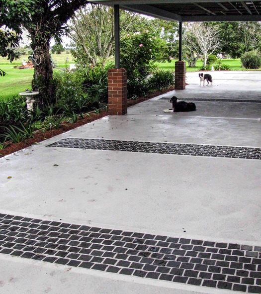 Cobble feature strips in country driveway