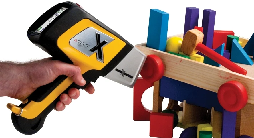 Olympus Innov-X DELTA Premium handheld XRF analyzer testing for lead contamination in toys