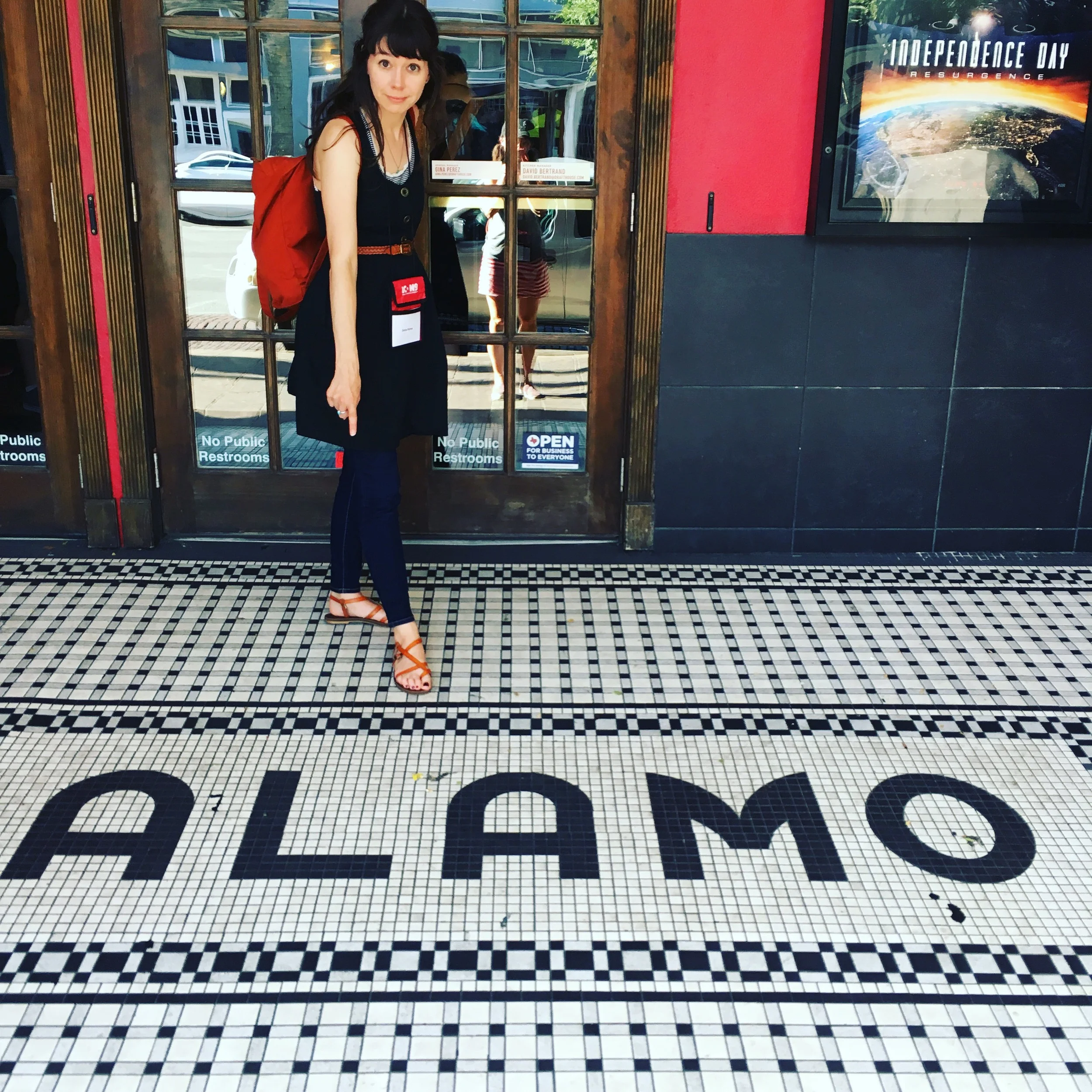 Denise pointing out the cool tile work at the entrance to the Alamo Drafthouse Cinema.