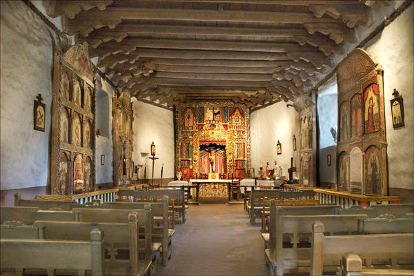  The interior of the Sanctuary Church.&nbsp; Photos aren't allowed, so this image is from their website - c. www.elsantuariodechimayo.us 