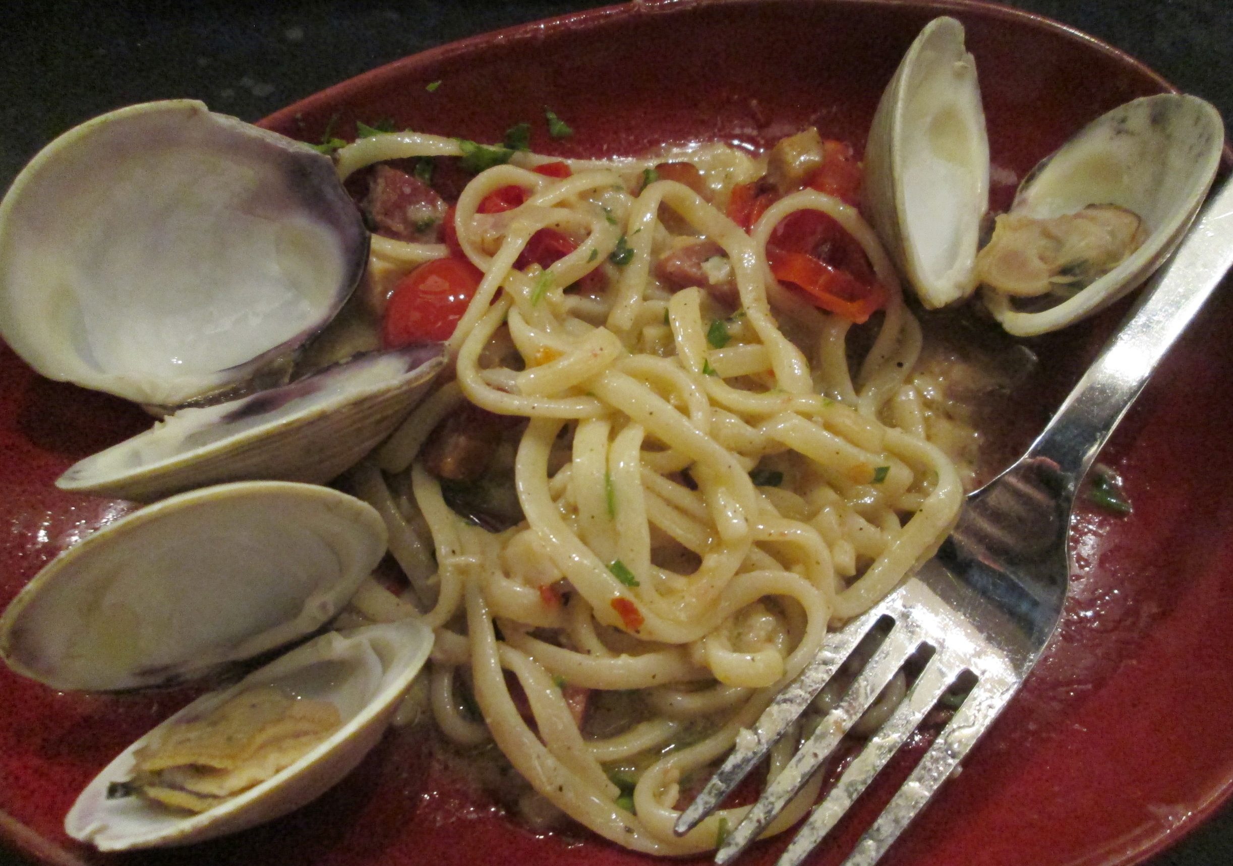  Half-eaten linguine and clams 