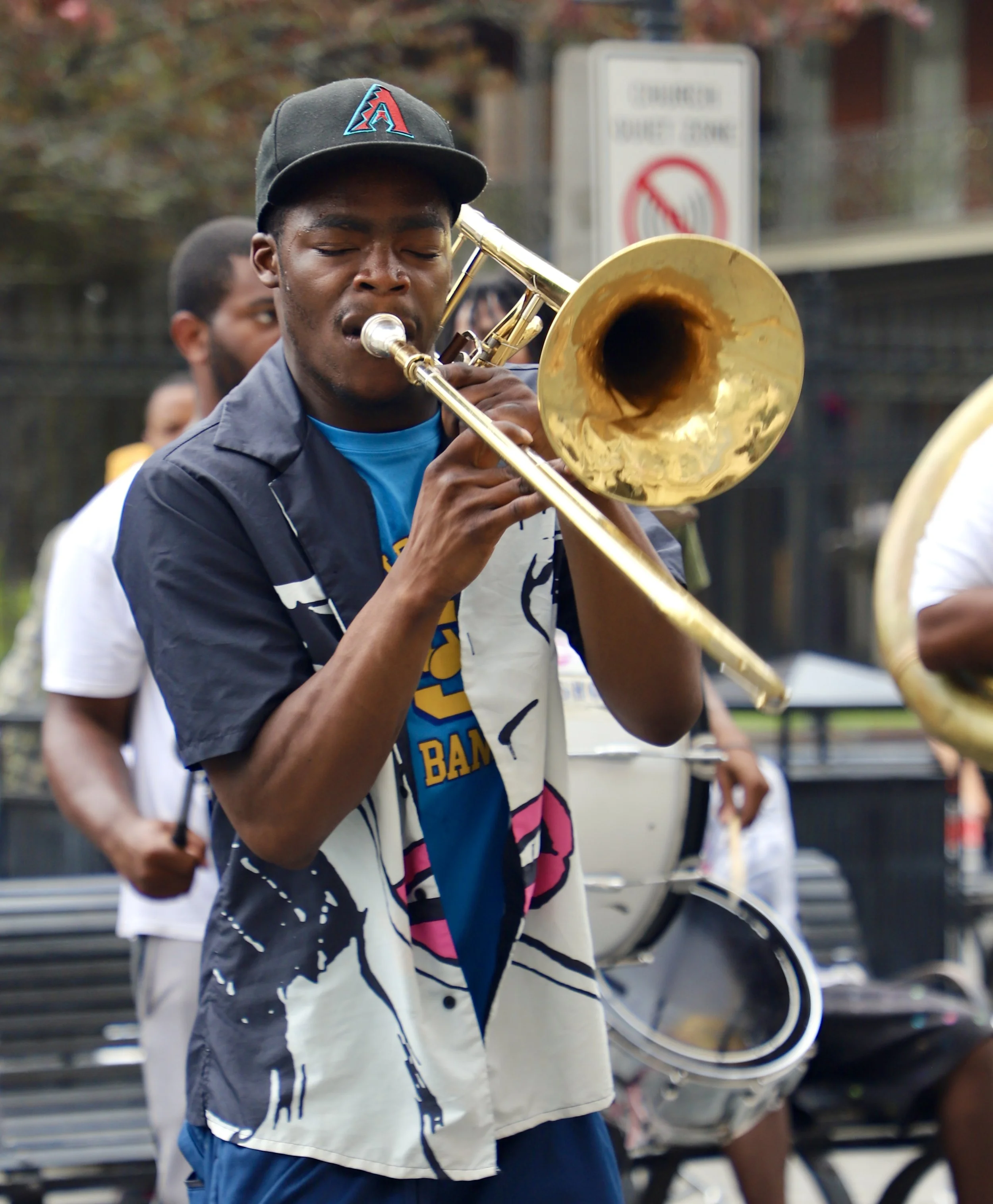  A member of Southern University band plays trombone alongside a band of about eight others. This group played for over an hour in the scorching heat right outside Jackson Square in the French Quarter.  