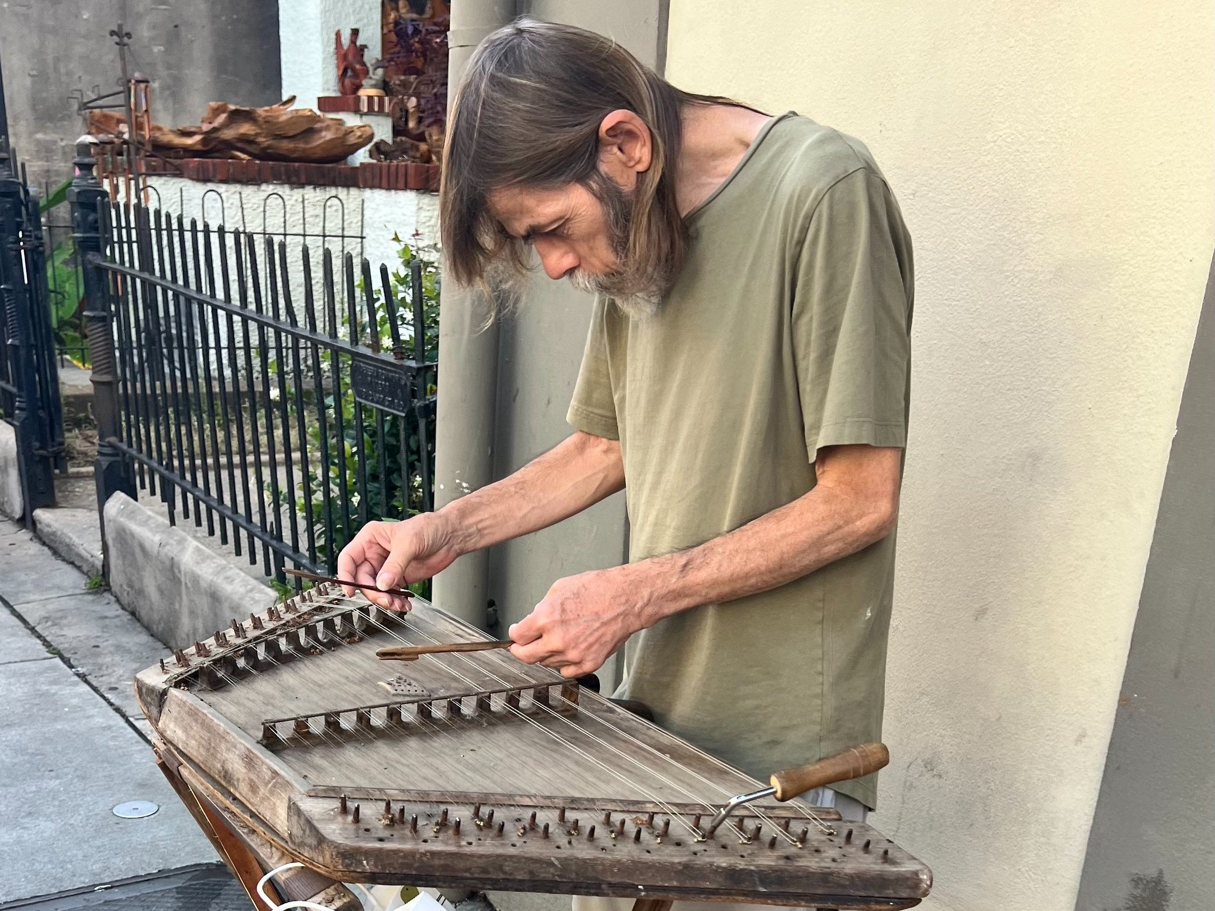 Random man playing some instrument...?