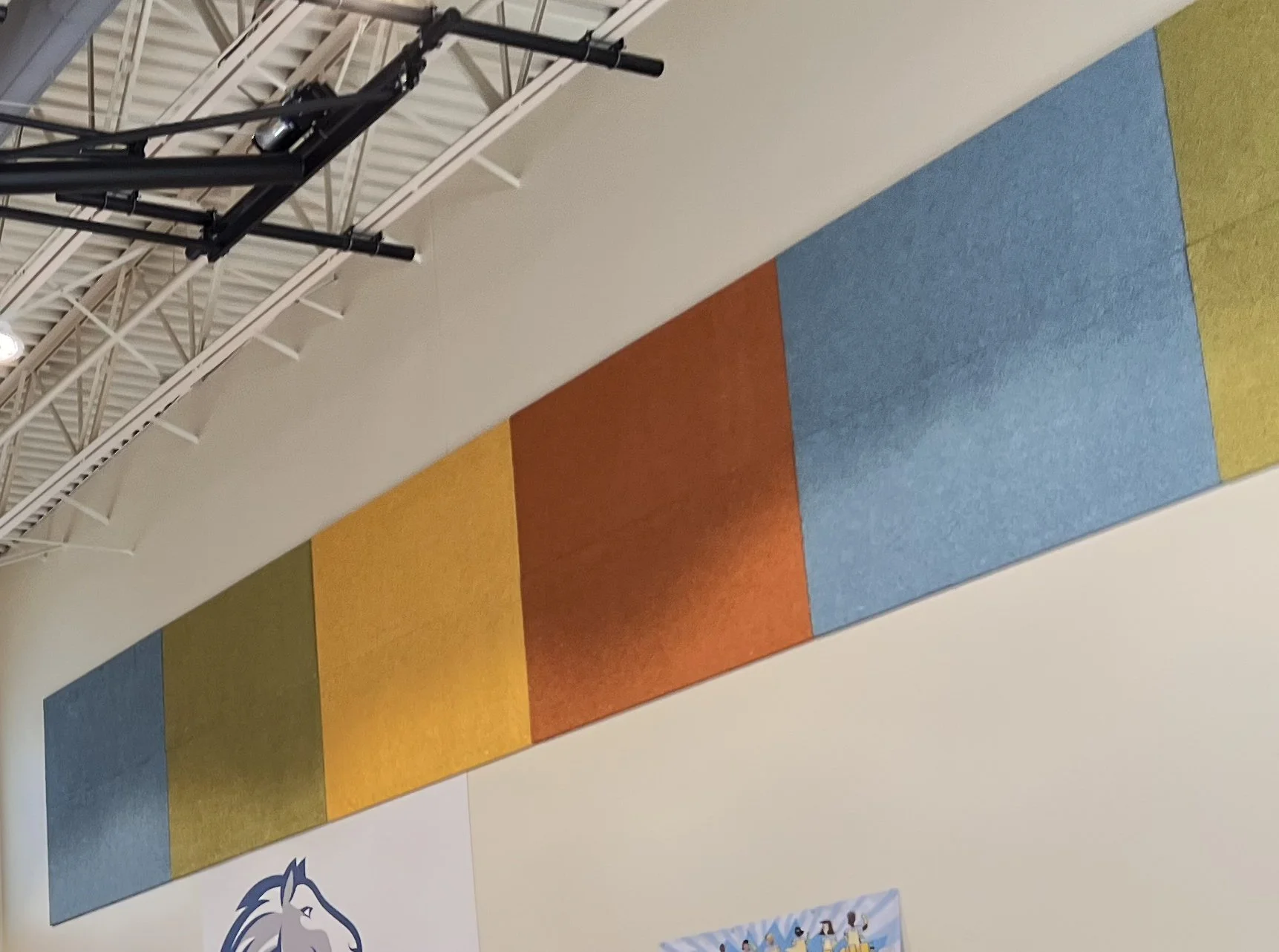 Banner displaying the four seasonal school colors at Ida Nason Aronica Elementary School in Ellensburg, Washington: Spring Green, Summer Yellow, Fall Orange, and Winter Blue