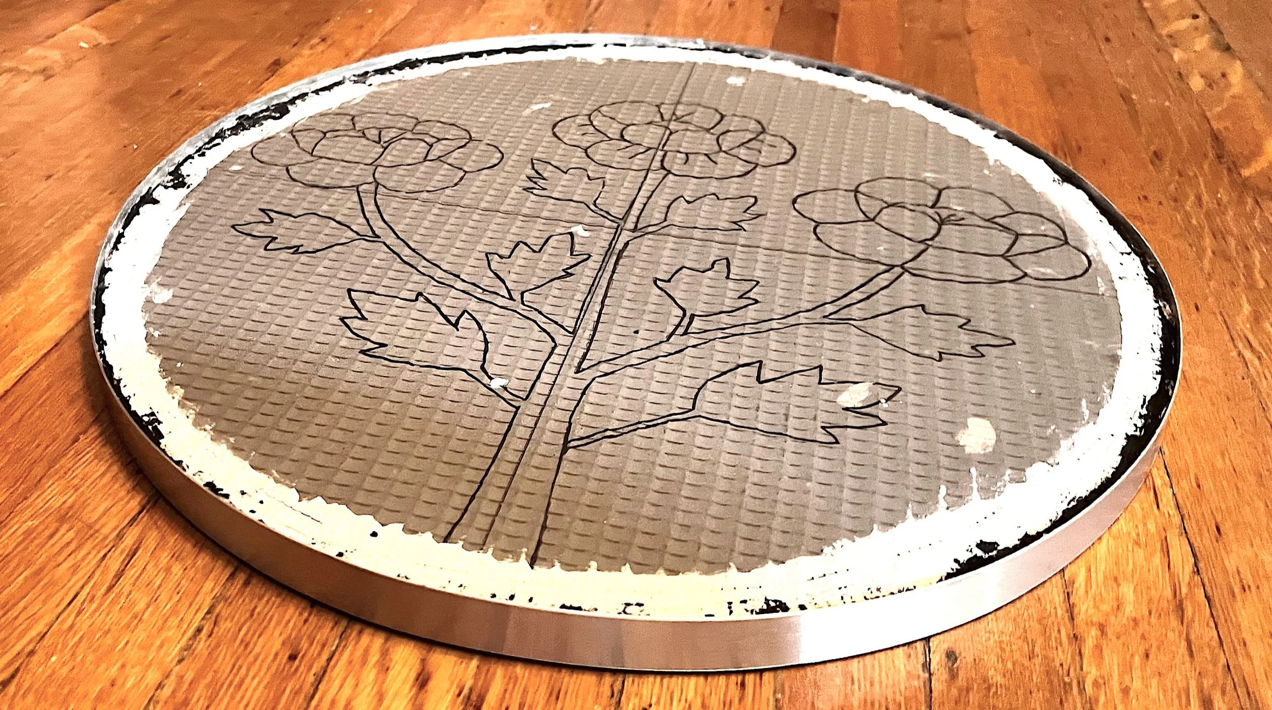 Wedi board mosaic panel with aluminum edging frame attached, prepared for the Cycles public art commission by Dyanne Williams