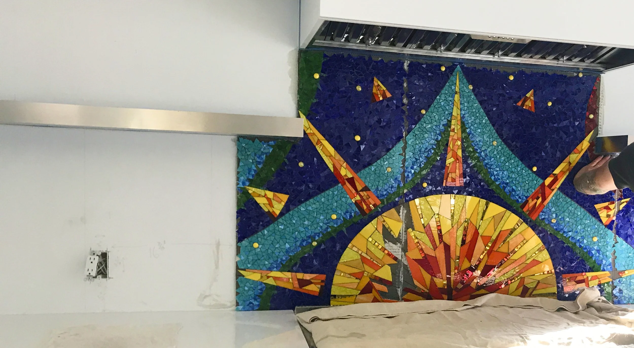 Sun Kitchen Mosaic Backsplash during installation.