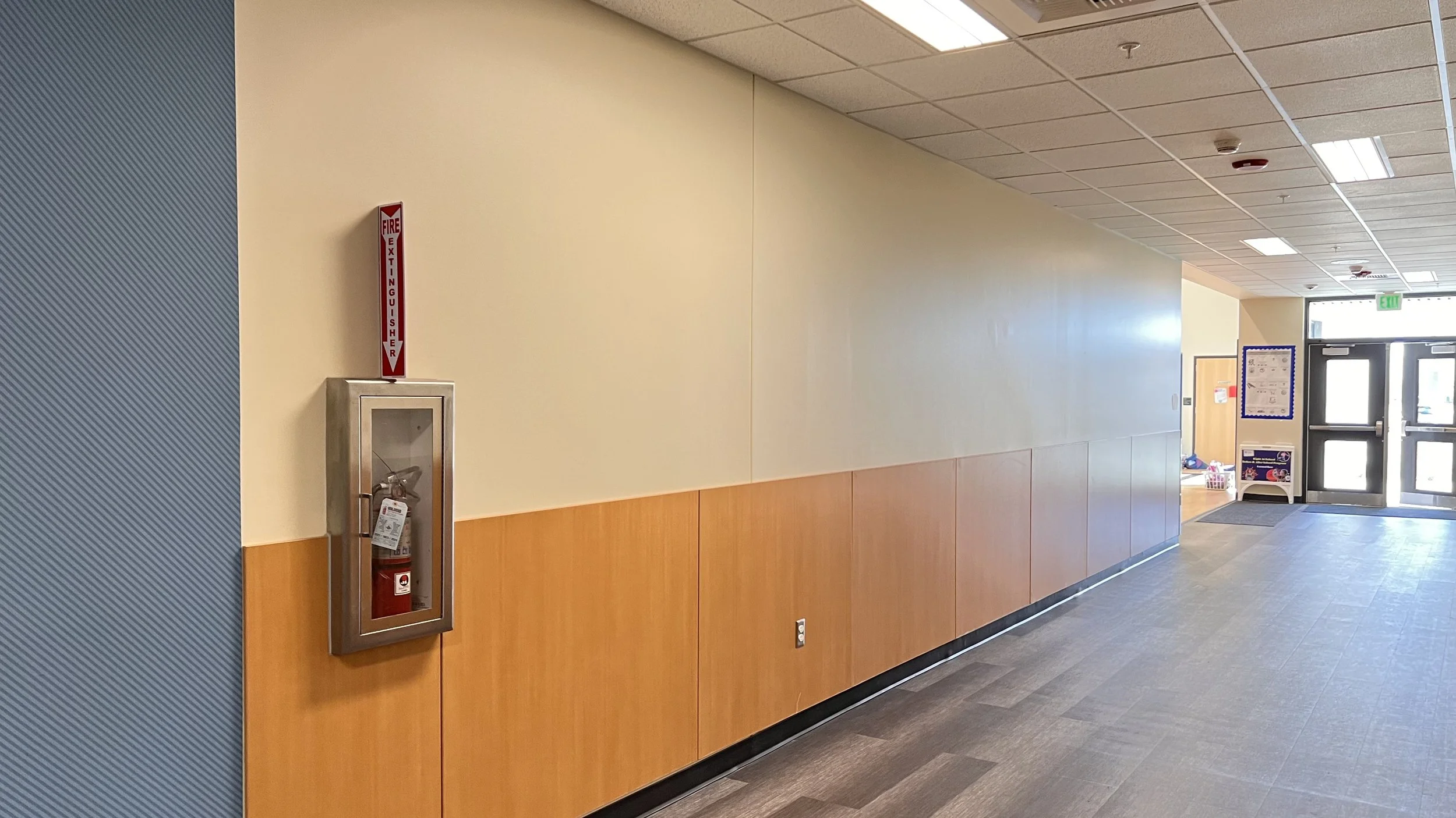 Empty hallway wall at Ida Nason Aronica Elementary School in Ellensburg, Washington, before installation of the Cycles glass mosaic public art commission by Dyanne Williams