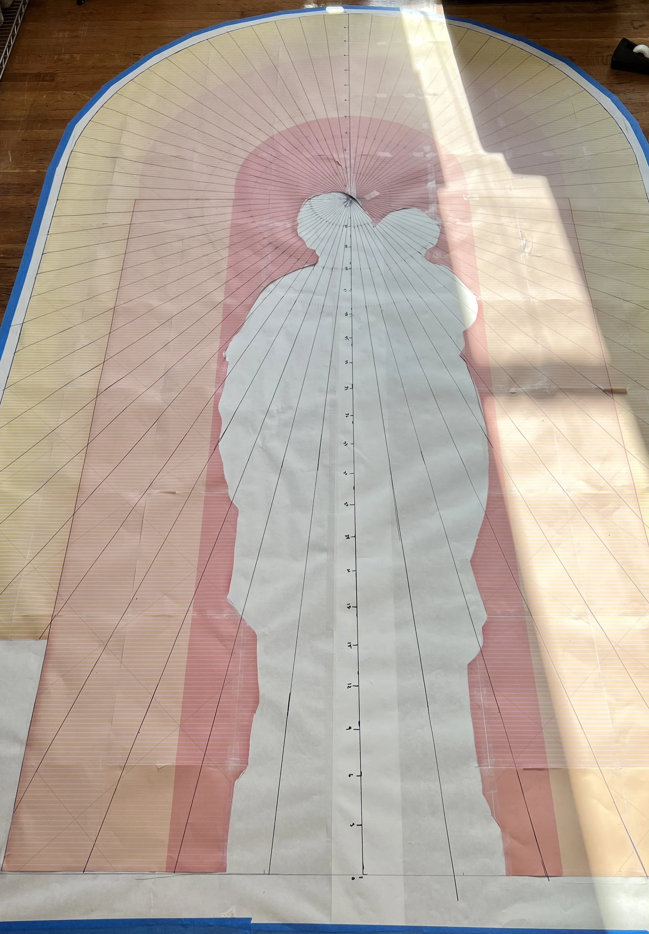 Full scale design with statue cutout used to check color placement.