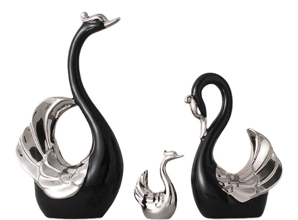 Black and silver swan sculptures