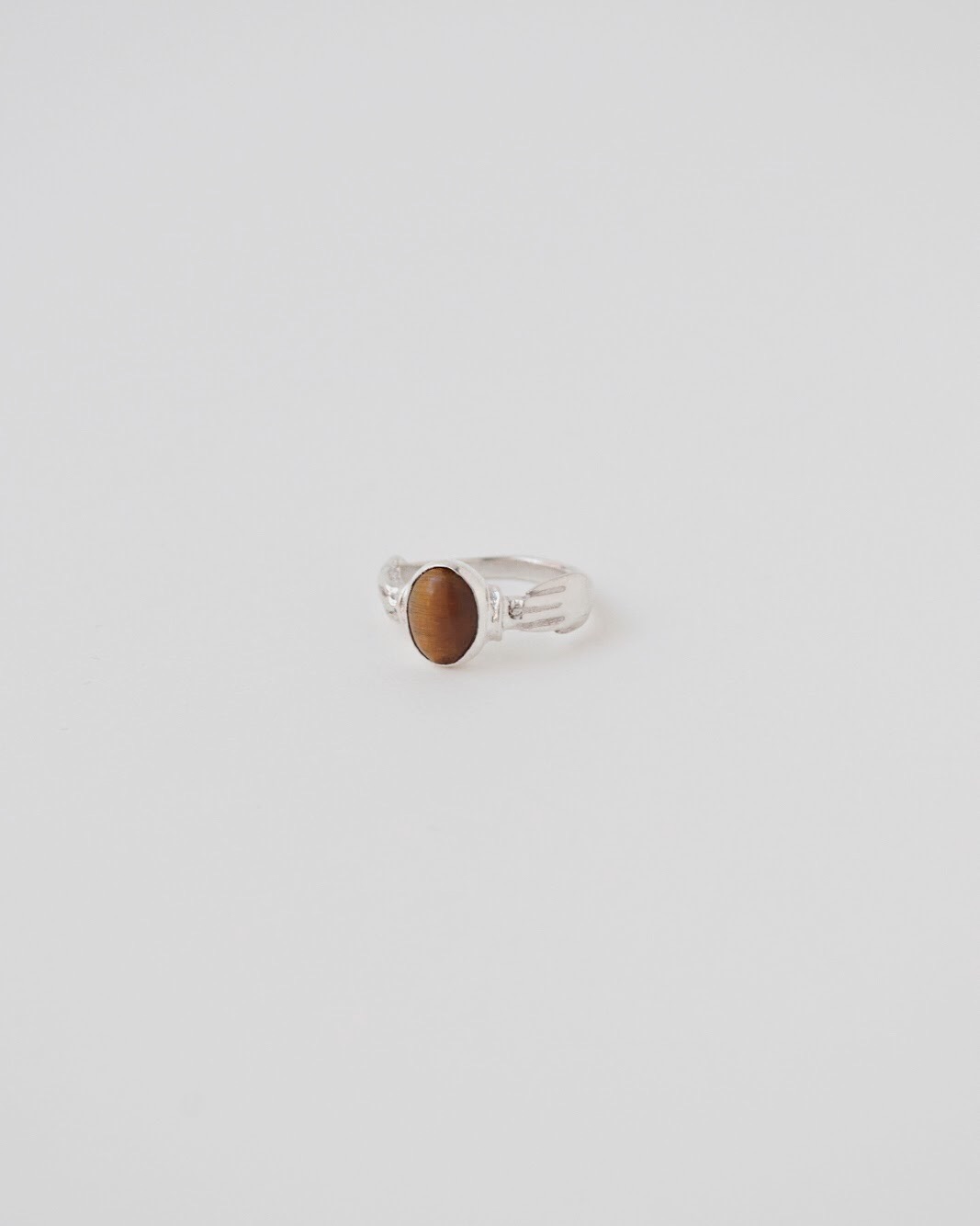 ring_hand_tigerseye_silver_bezel.jpg