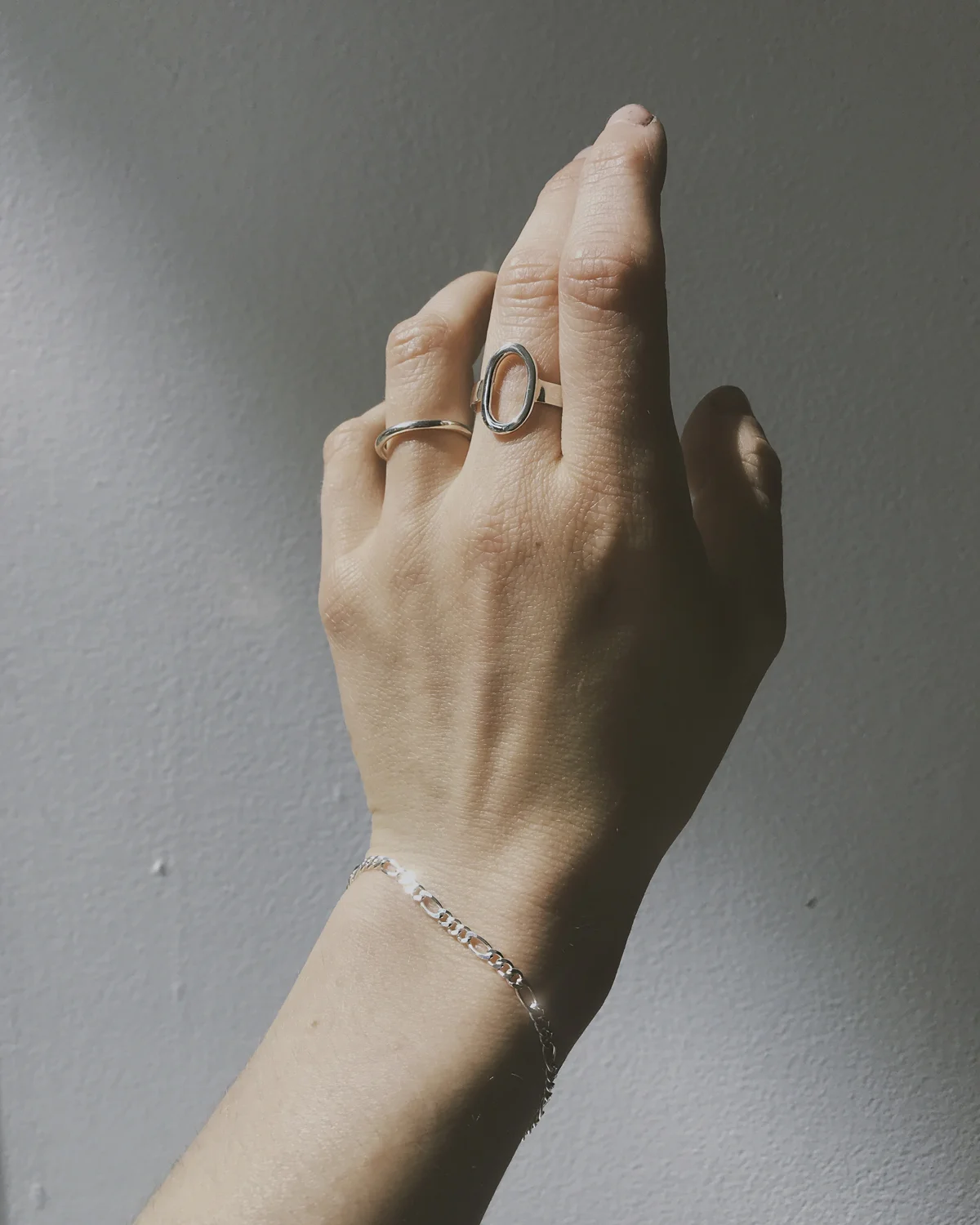 silver_oval_ring_figaro_chain_bracelet.jpg