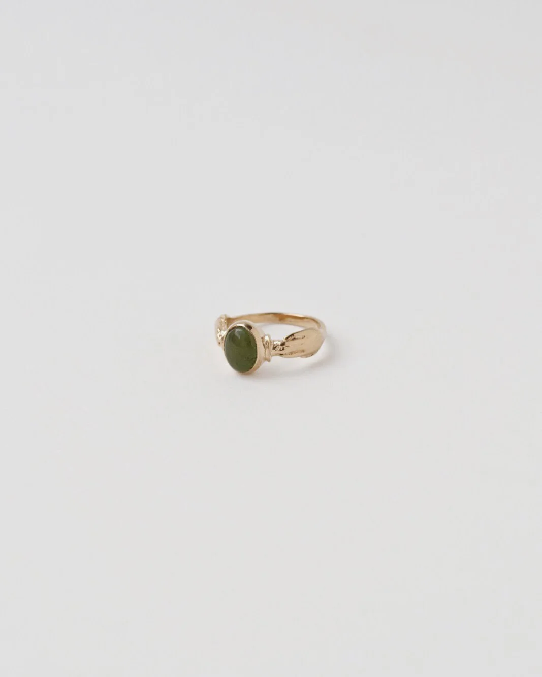 ring_oval_gold_gemstone_hand_jade.jpg