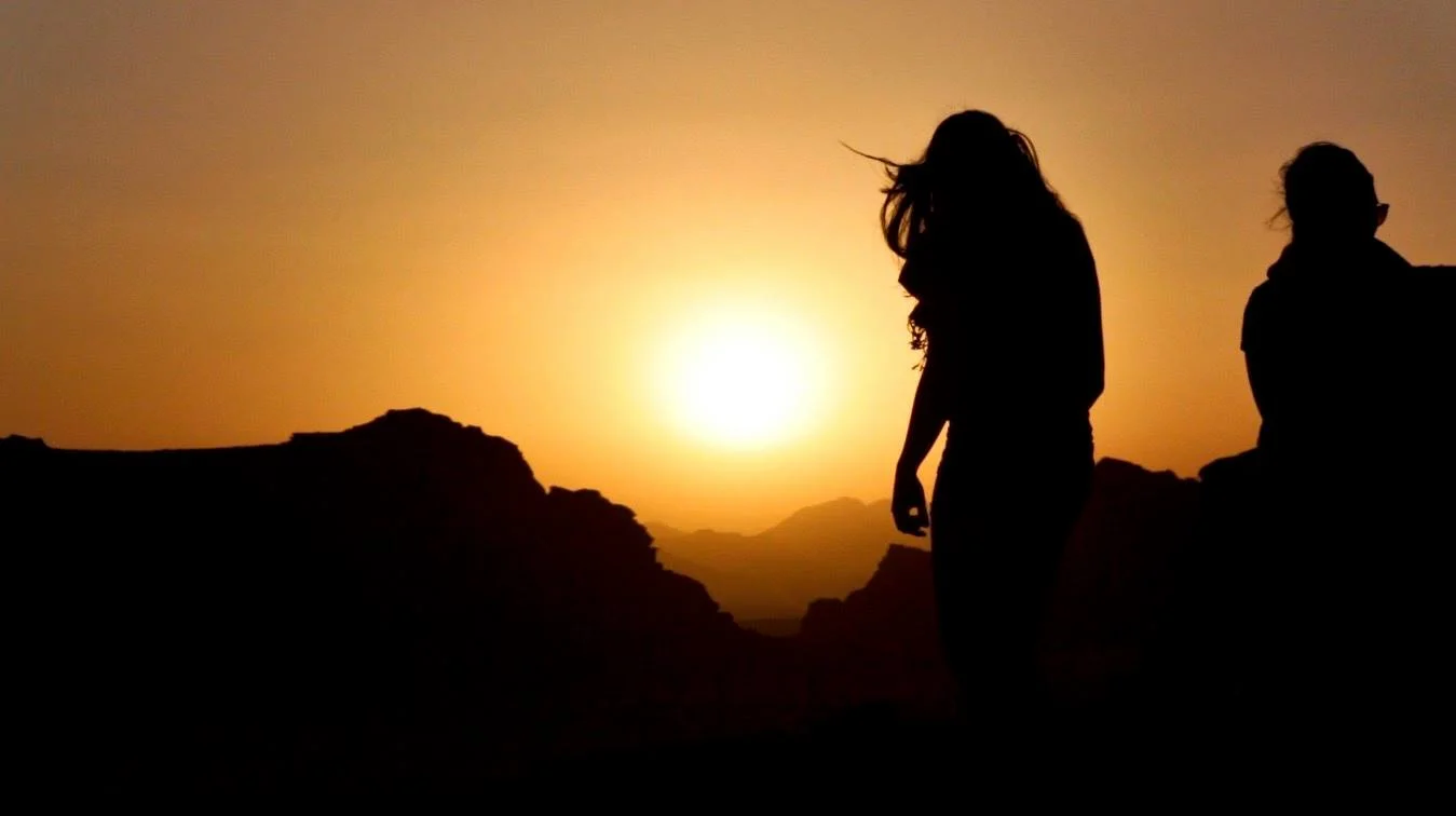 Climbing rock formations above the Bedouin camp in Wadi Rum.