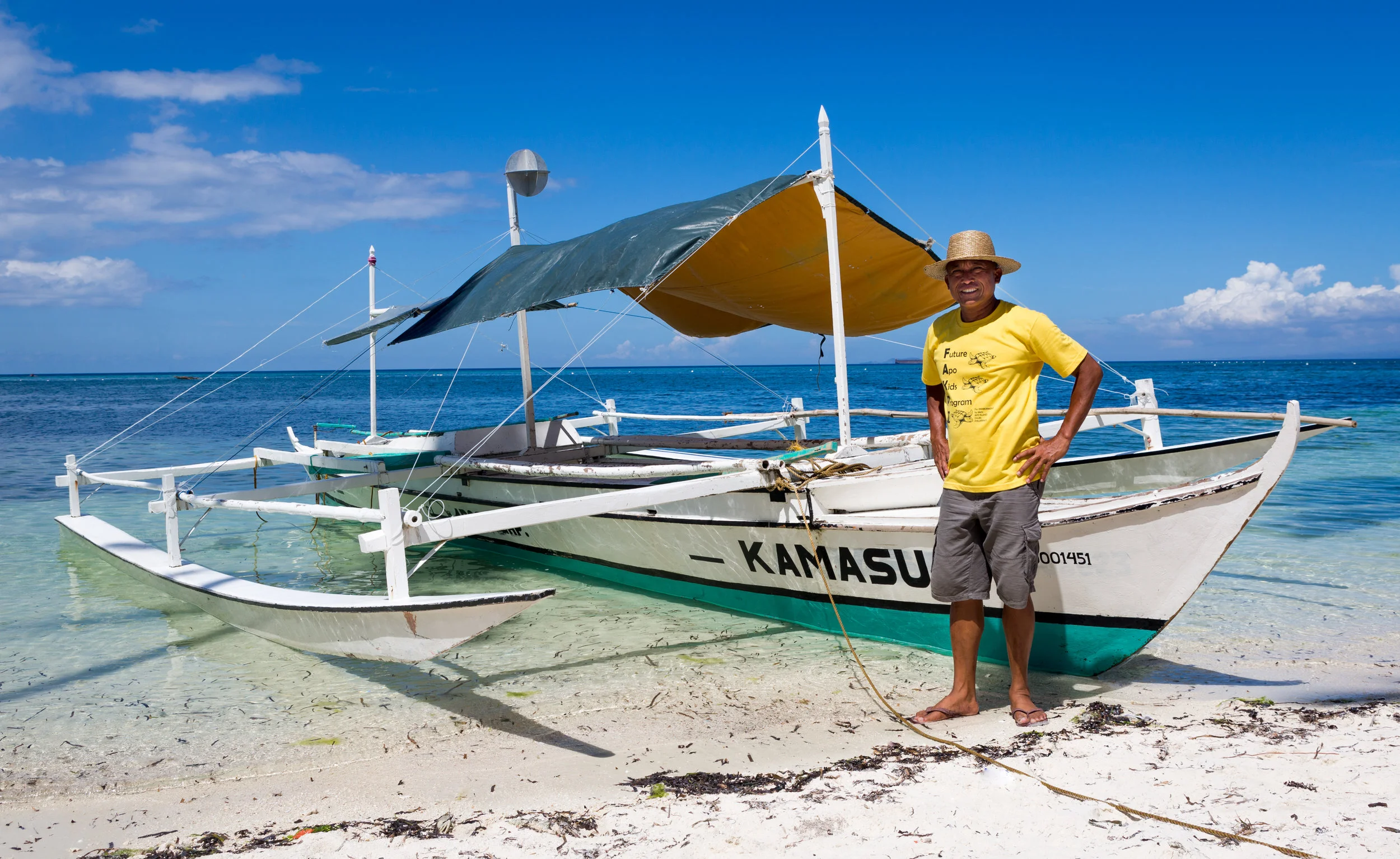 Mario Pascobello standing by his boat at Siquijor Island