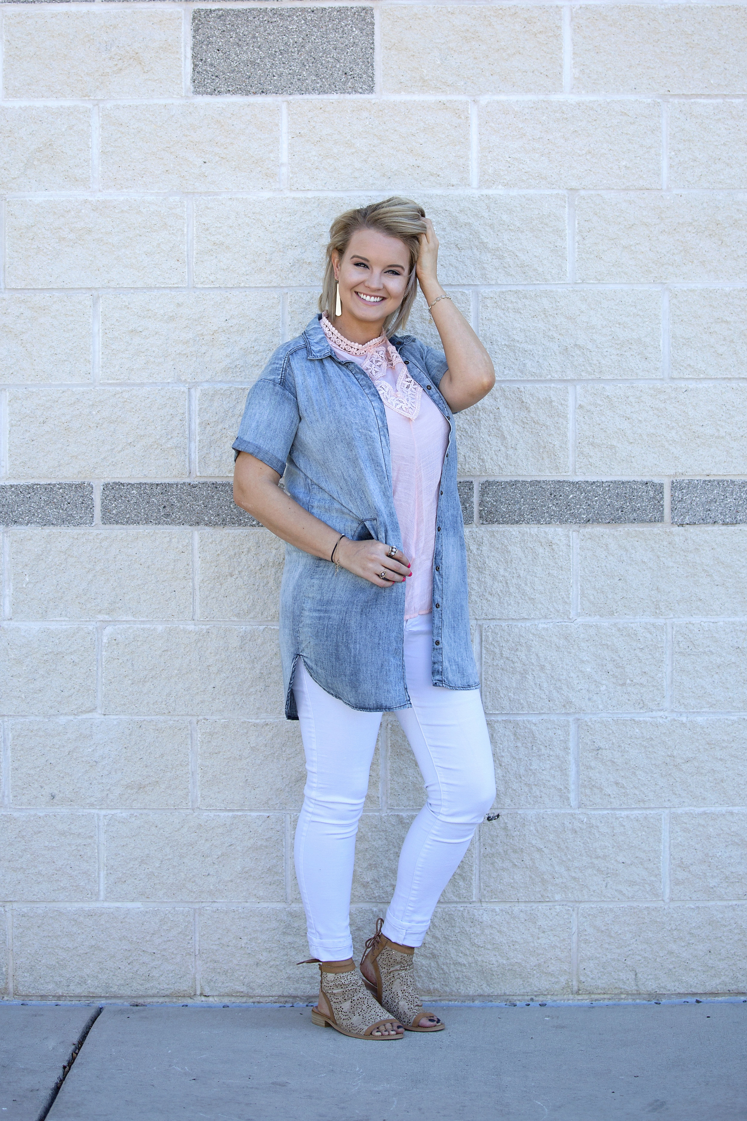 Kellea chose a pink She & Sky top with white PAIGE pants for this look.