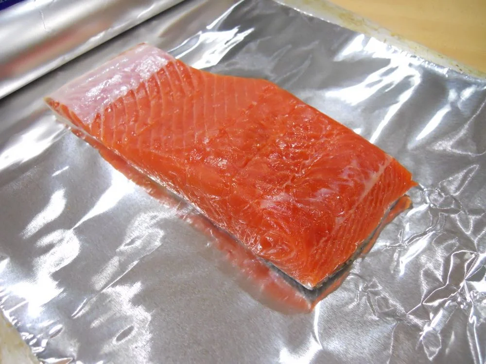 So easy, add your salmon to aluminum foil that can cover the whole slab.
