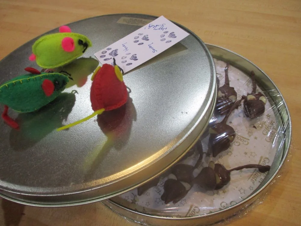 Photo 2: Package chocolate mice in a tin container to keep the almond ears from breaking and add toy mice on top instead of a ribbon for a feline treat. (Photos by Charlotte Ekker Wiggins)