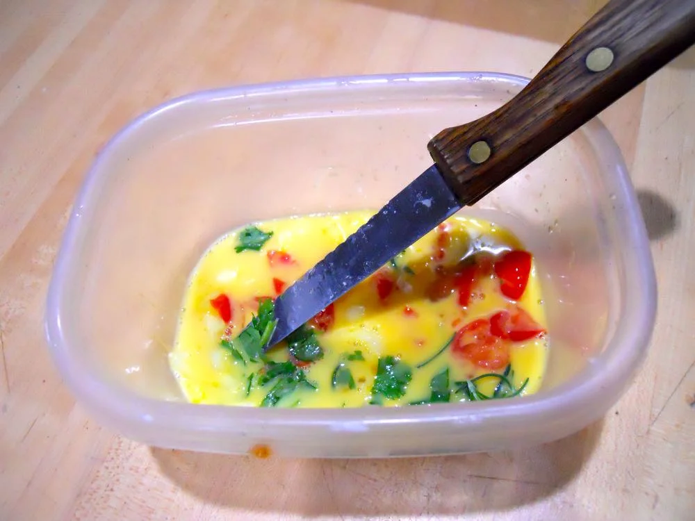 Here's the egg omelet mixture ready to use, add something green to brighten up the mixture.