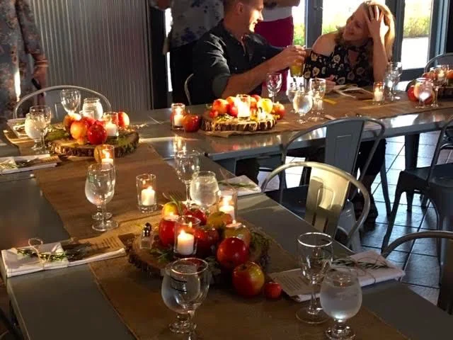 Guests September 20, 2018 were greeted with these lovely table scapes of apples and candles.