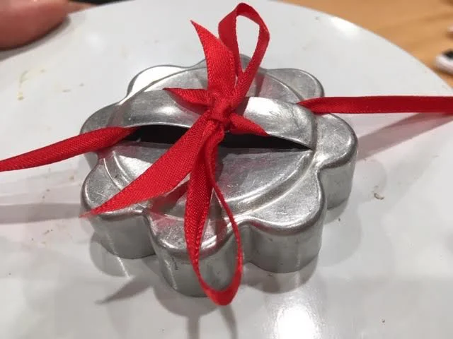 Easily turn a cookie cutter into a gift box bow using a small ribbon. (Photo by Charlotte Ekker Wiggins)