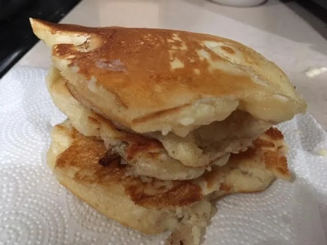 Once cooked, keep pancakes on paper towel to absorb cooking oil. (Photo by Charlotte Ekker Wiggins)