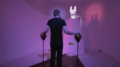 A player and a projection-mapped statue discuss the future.