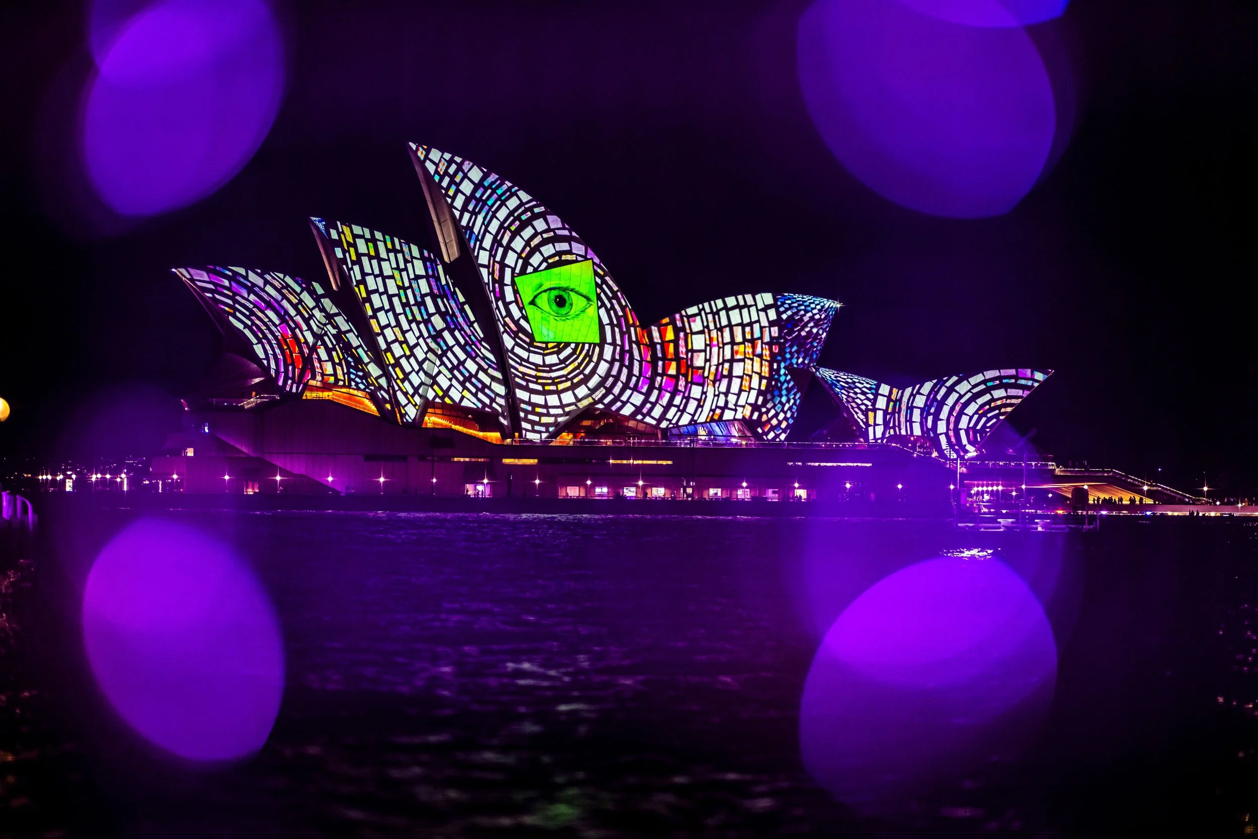 Shot of Opera House with an eye and patterned spiral with David McDiarmid's work for VIVID