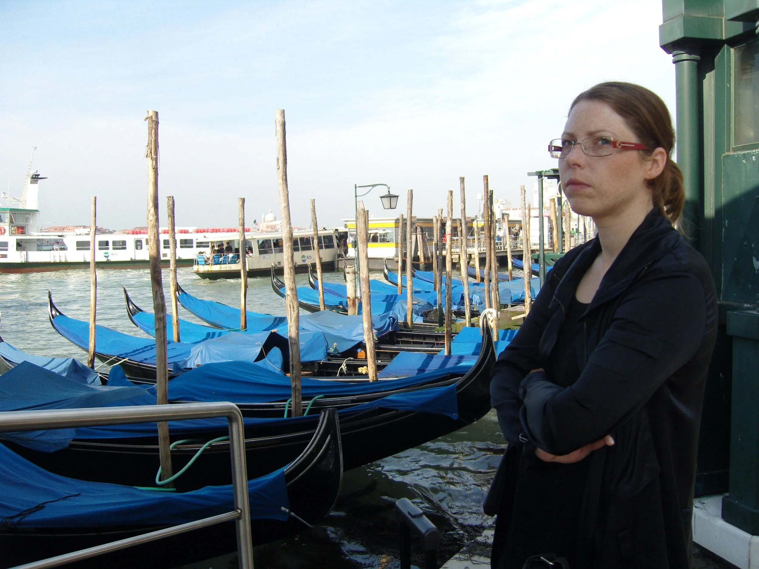 Art critic trying to define the Scandinavian pain while waiting for her water taxi. Photo: © Zenta Dzividzinska.