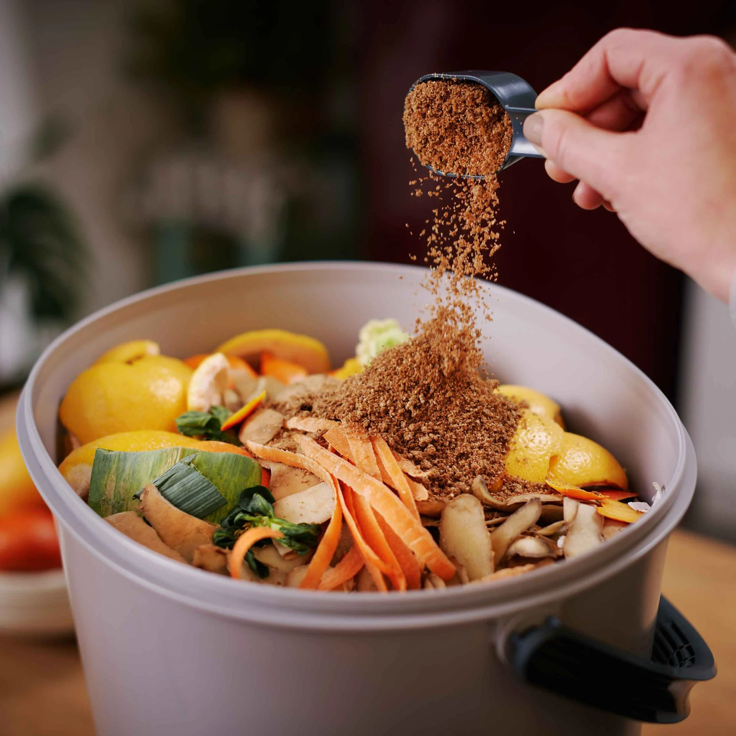 Sprinkling-bokashi-bran-in-Bokashi-Organko-Essential-(2) image-web.jpg