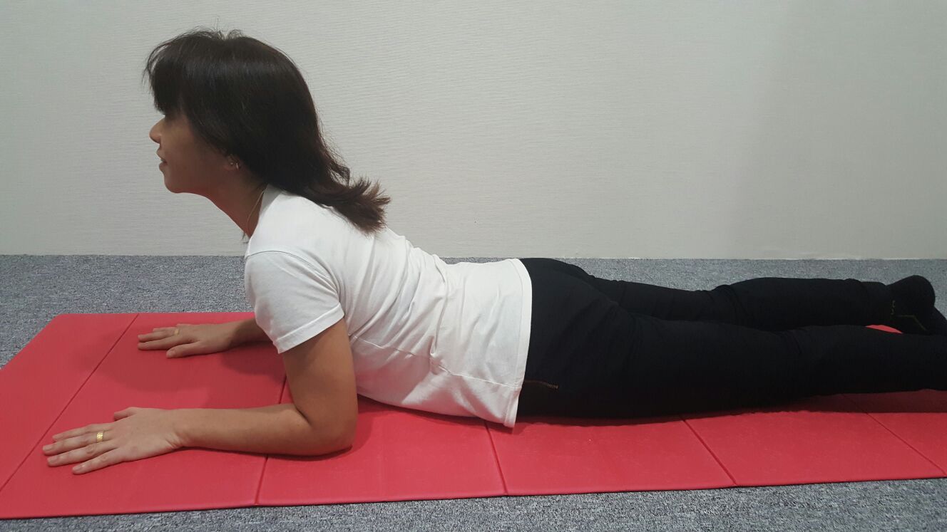 Back extension, lengthening the spine.