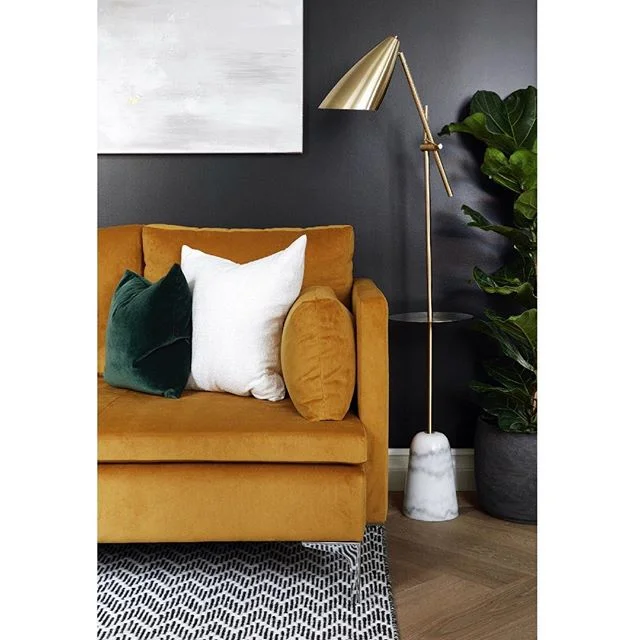When designing moody dark rooms, velvets are the perfect material to compliment the darkness either by contrasting it or by showing off the hues of the same colour (ie. blue wall against blue velvet). For the black walls of this living room we chose Ravens Flight by Dulux Heritage @duluxuk as it’s not “black hole black” and doesn’t completely absorb all the light and we contrasted this with a velvet mustard sofa, and white and greens in the accessories, art and plants! We designed this project in collaboration with @dhliberty @dara_huang for a show home in the Hampstead Manor development 💛 - #houseofsuisui - - #interiorslondon #residentialdesign #hospitalitydesign #residentialdevelopment #hoteldesign #boutiquehotelawards #furnituredesign #londondesign #londoninteriors #interiordesigner #designblog #interiorblog #interiormagazine #art #tatemodern #interiorinspiration #theworldofinteriors #elledecor #shoreditchhouse #sayhito #vogueliving #britishdesign #instainterior #instadecor #instadesign #hoteldevelopment #deezeen #wallpapermag #livingroom