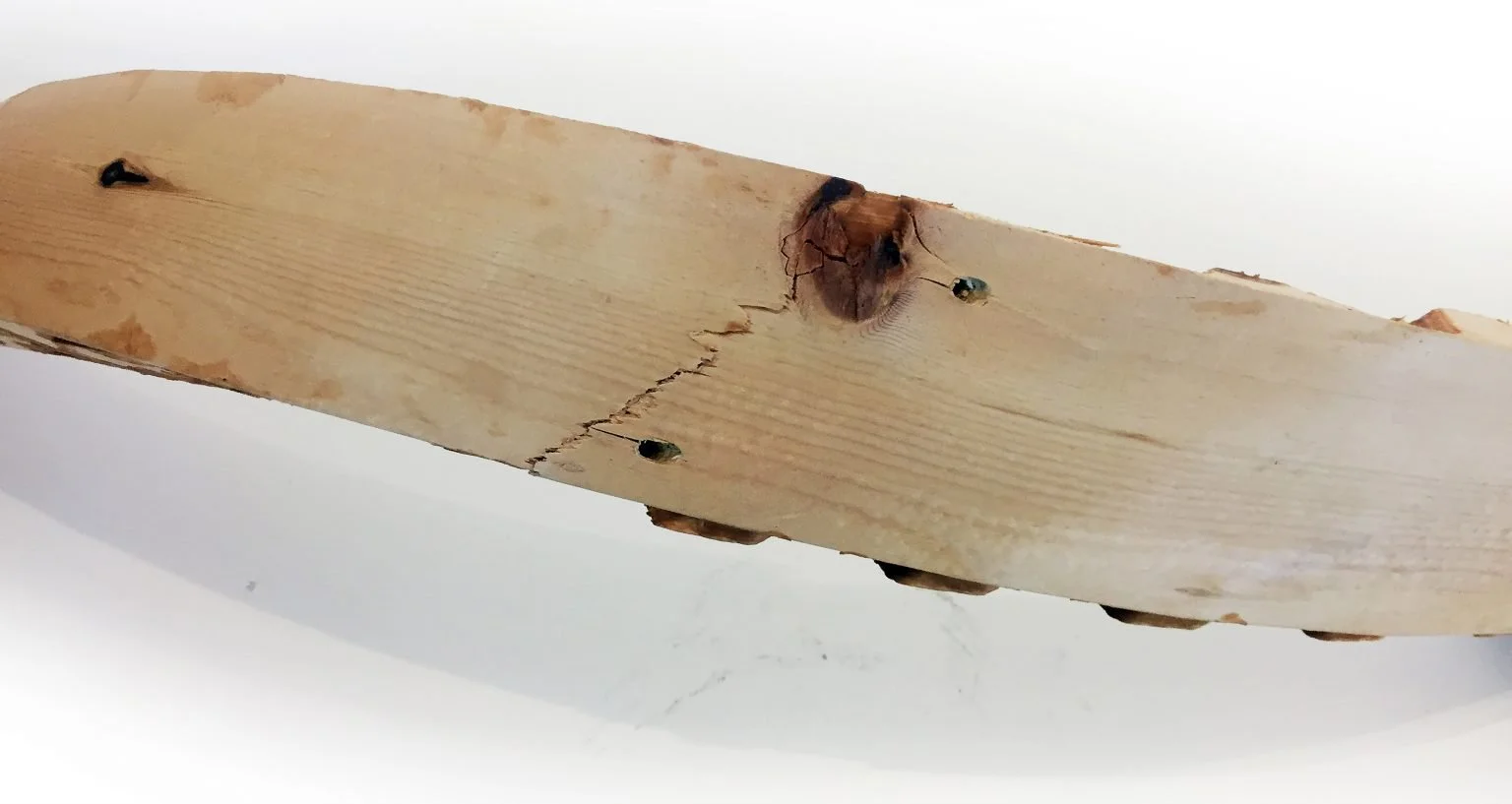 Fig.1: Knots, screw-holes, and other imperfections are challenges when bending material.