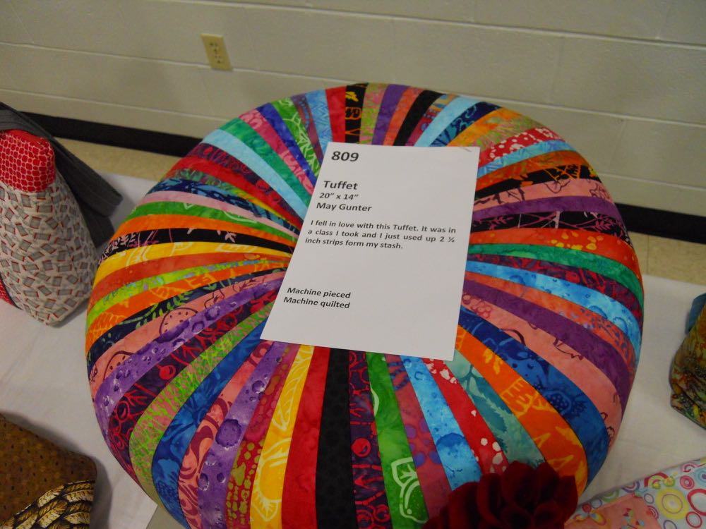 The handmade tuffet with a printed explanation.